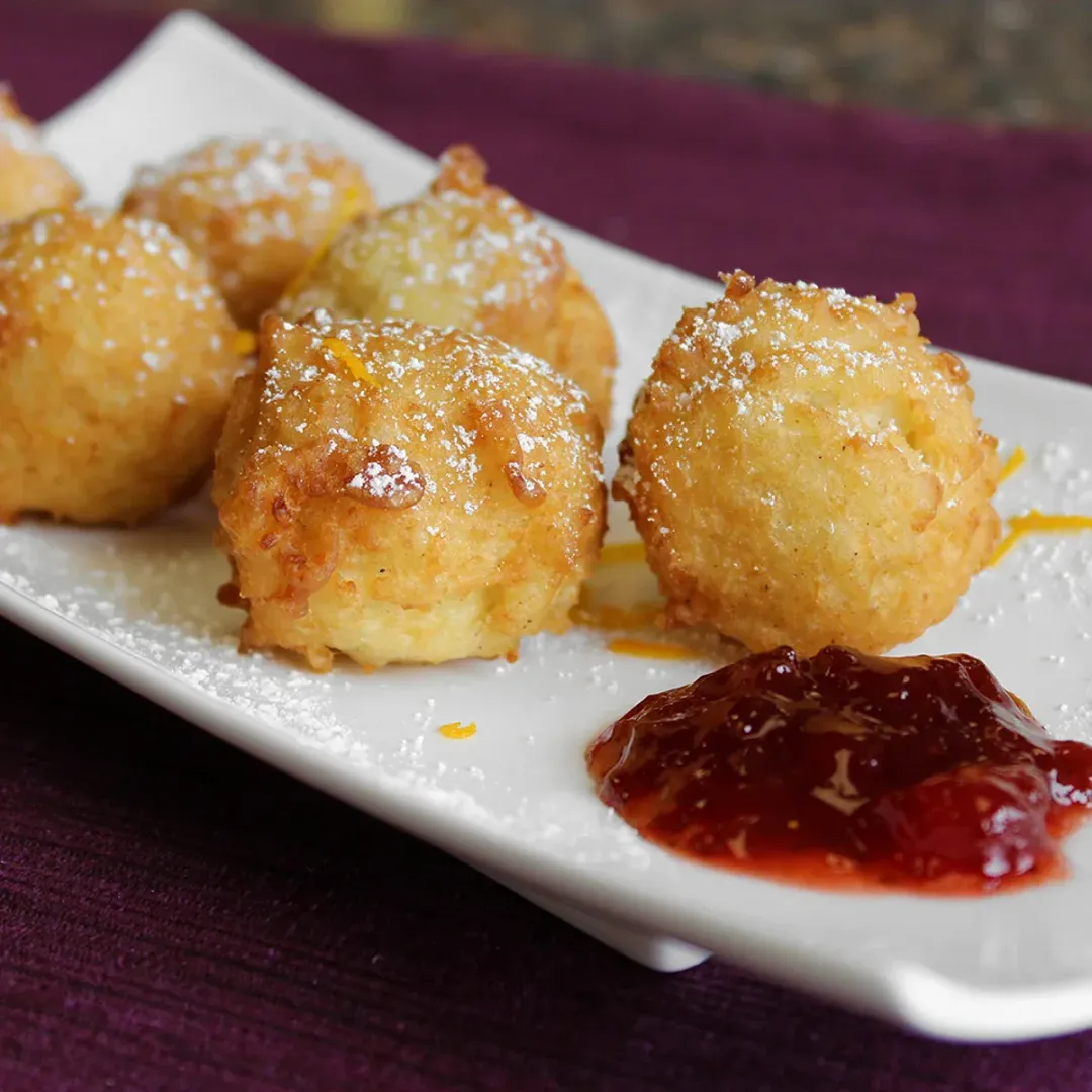 https://d3xhk4vytuuf2.cloudfront.net/Cinnamon-Rice-Fritters.webp