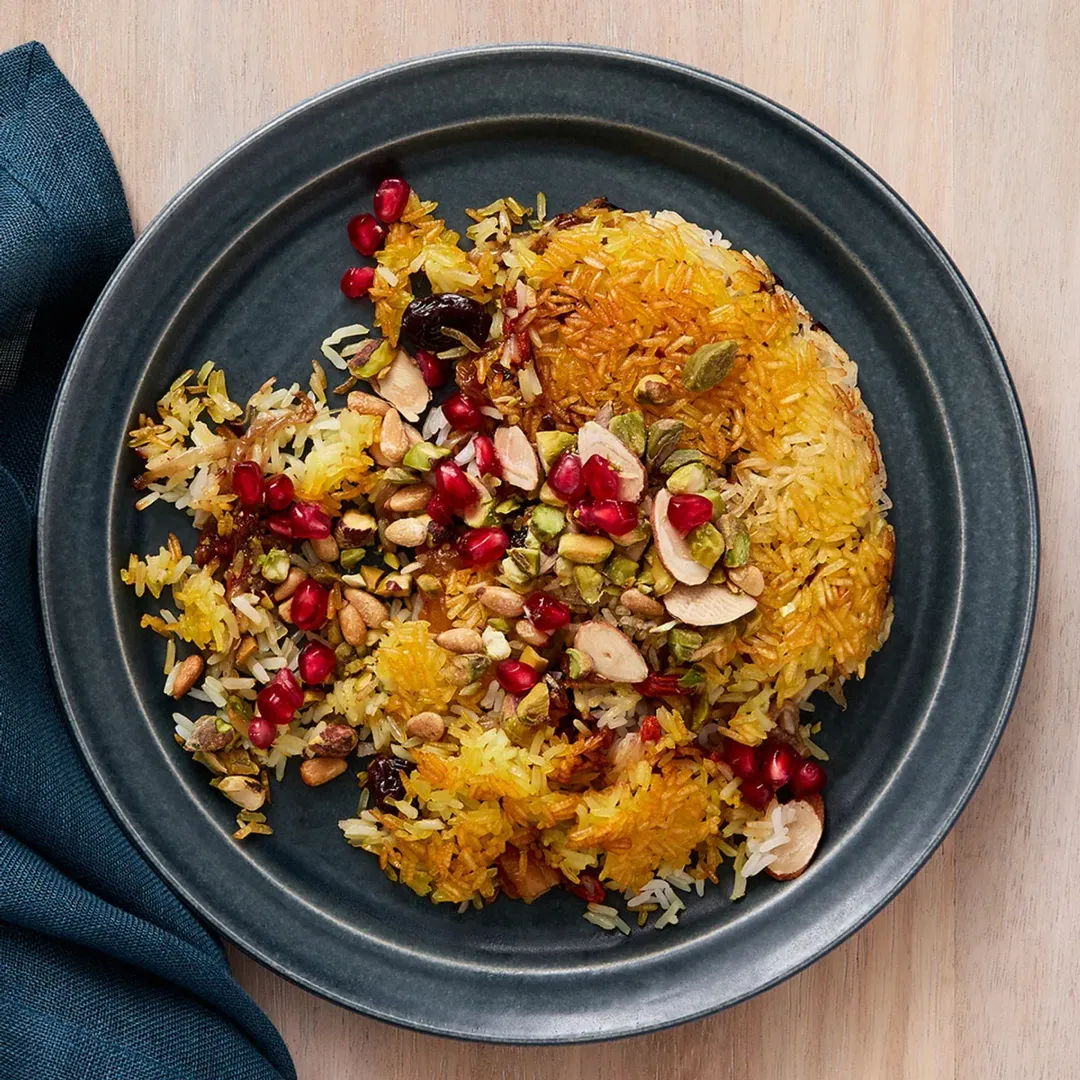 https://d3xhk4vytuuf2.cloudfront.net/Jeweled-Rice-with-Dried-Fruit-and-Nuts-Recipe.webp
