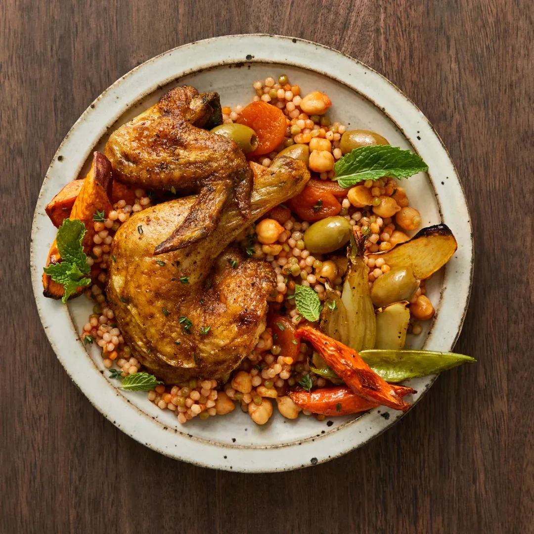 https://d3xhk4vytuuf2.cloudfront.net/Moroccan-Spiced-Roast-Chicken-with-Pearl-Couscous-and-Chickpea-Stew.webp