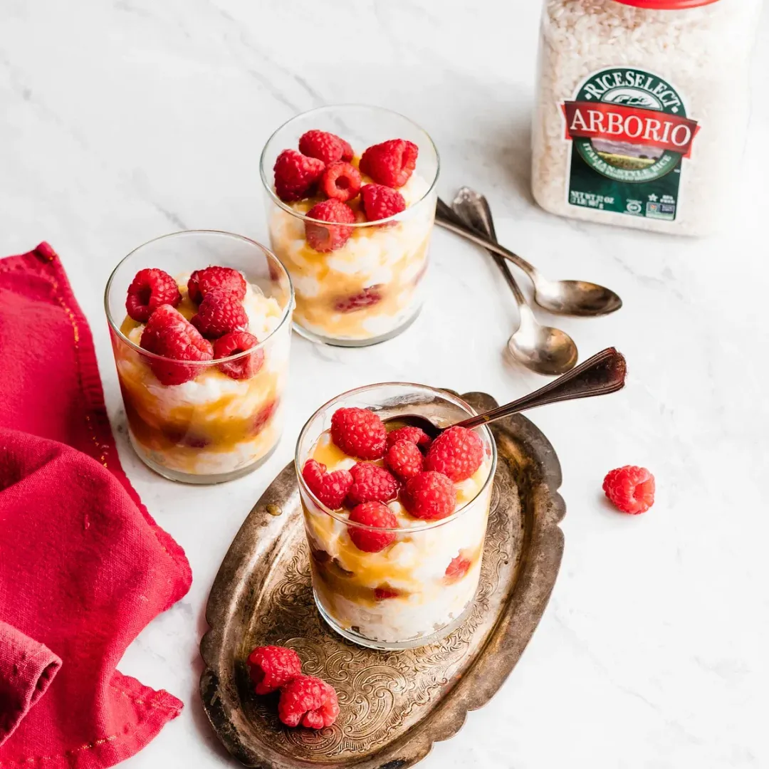 https://d3xhk4vytuuf2.cloudfront.net/Peach-Curd-and-Raspberry-Rice-Pudding-Parfait.webp